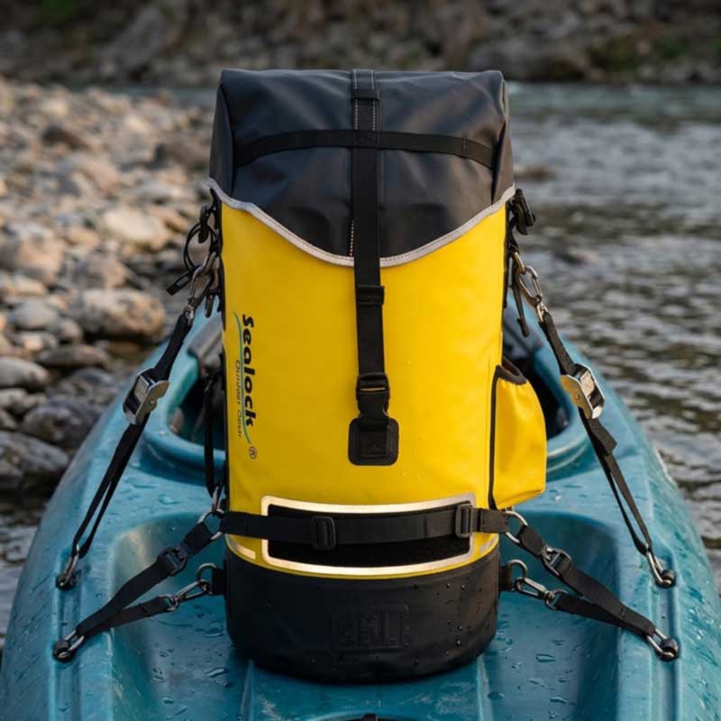 Reinforced lash point and D-ring under load on a kayak dry bag with reflective trim